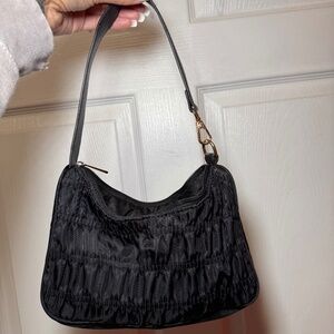 All black ruffled shoulder purse